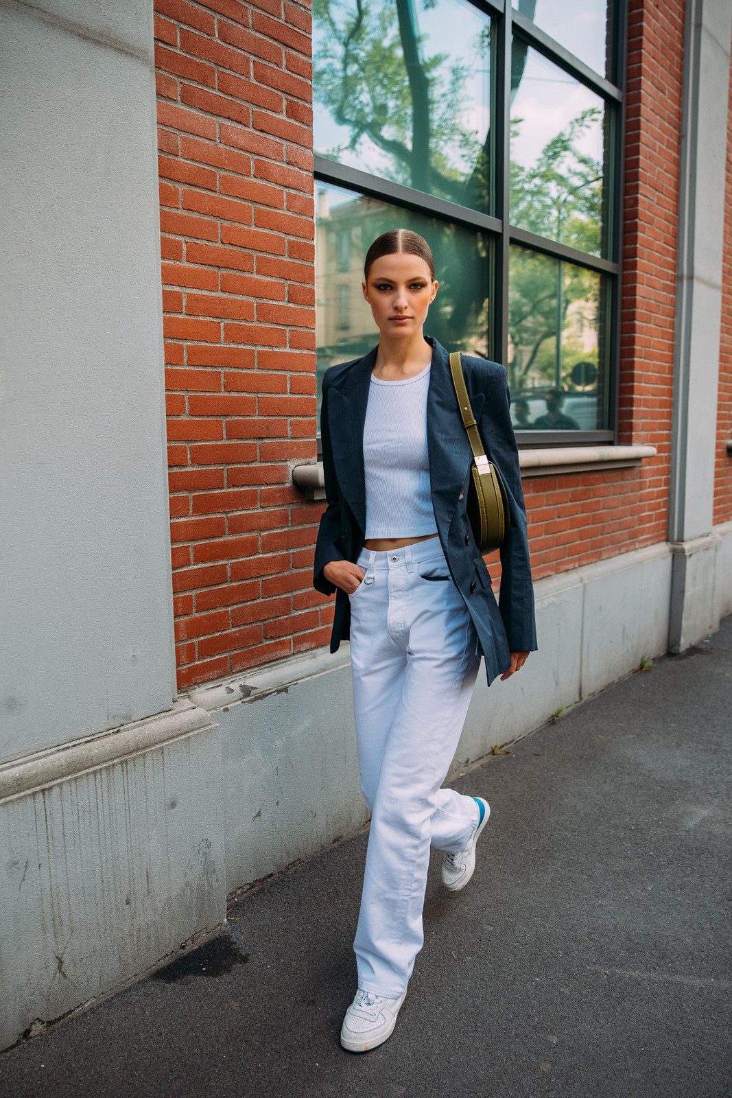Crisp White Jeans Paired with a Navy Blazer and Crop Top Crisp White Jeans Paired with a Navy Blazer and Crop Top — White Jeans Outfits 2027