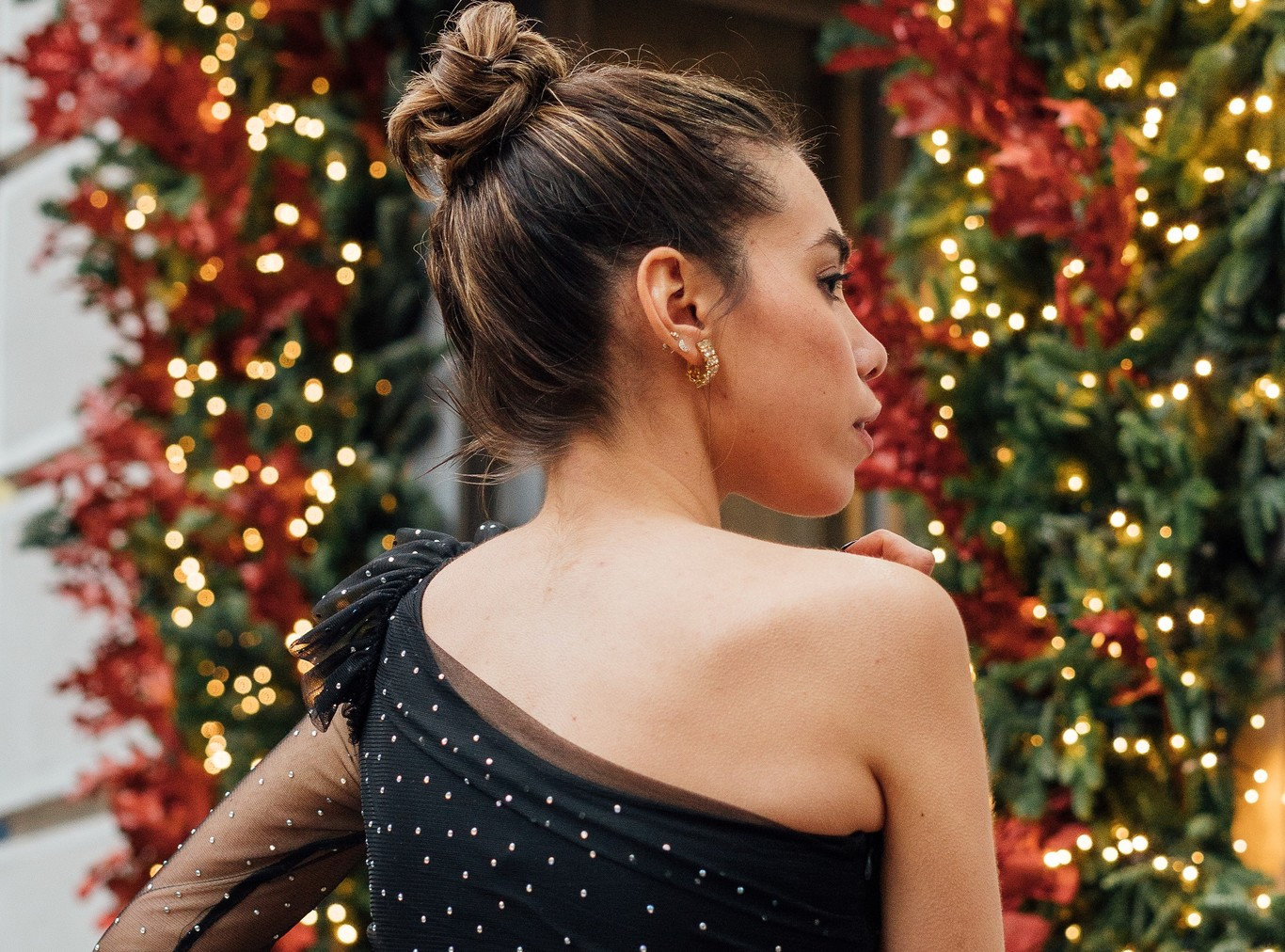 Sleek Brunette Top Knot With Face-Framing Wisps — Christmas Hairstyles 2026