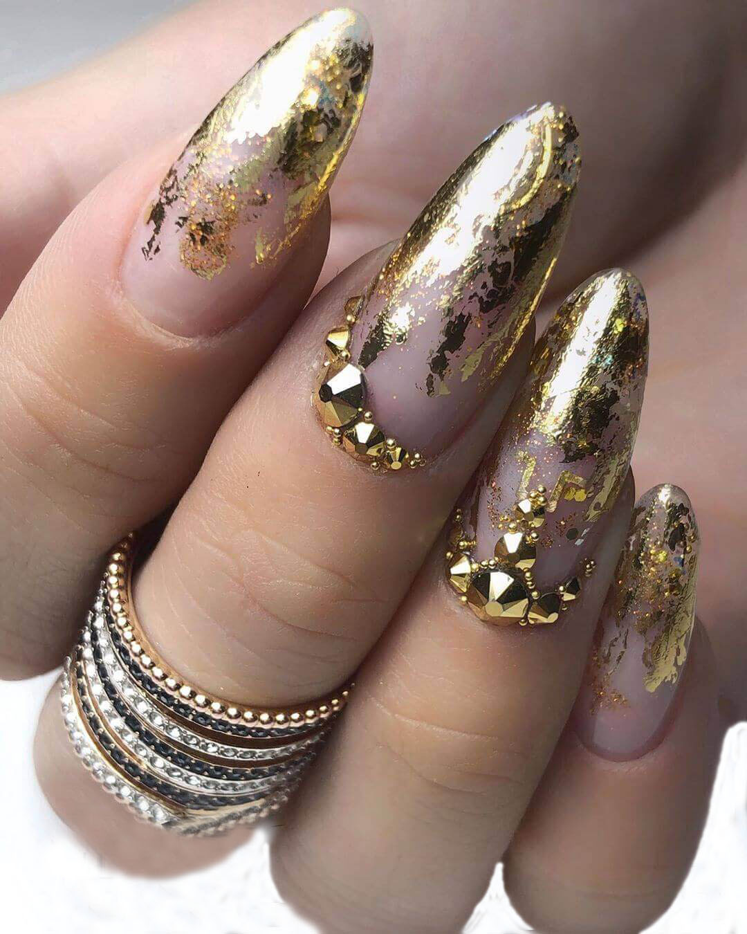 Dramatic Gold Foil Fragment Stilettos Dramatic Gold Foil Fragment Stilettos — Gold Christmas Nails 2026