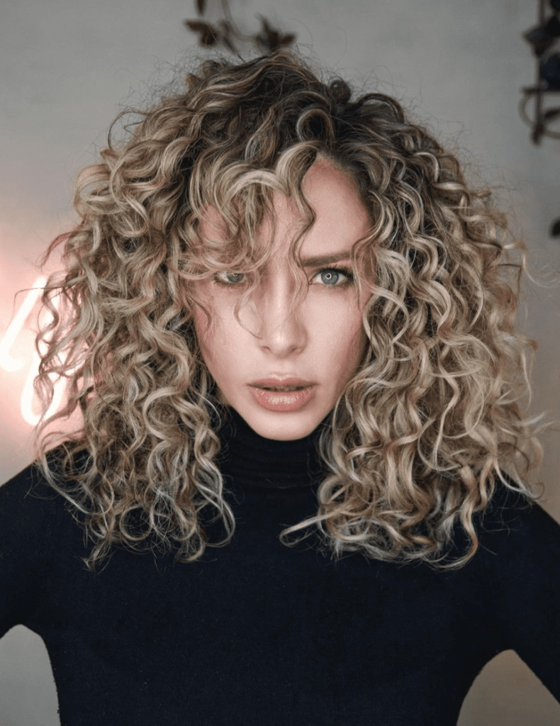 Voluminous Blonde Curls With Curly Bangs Voluminous Blonde Curls With Curly Bangs — Summer Hairstyles 2027