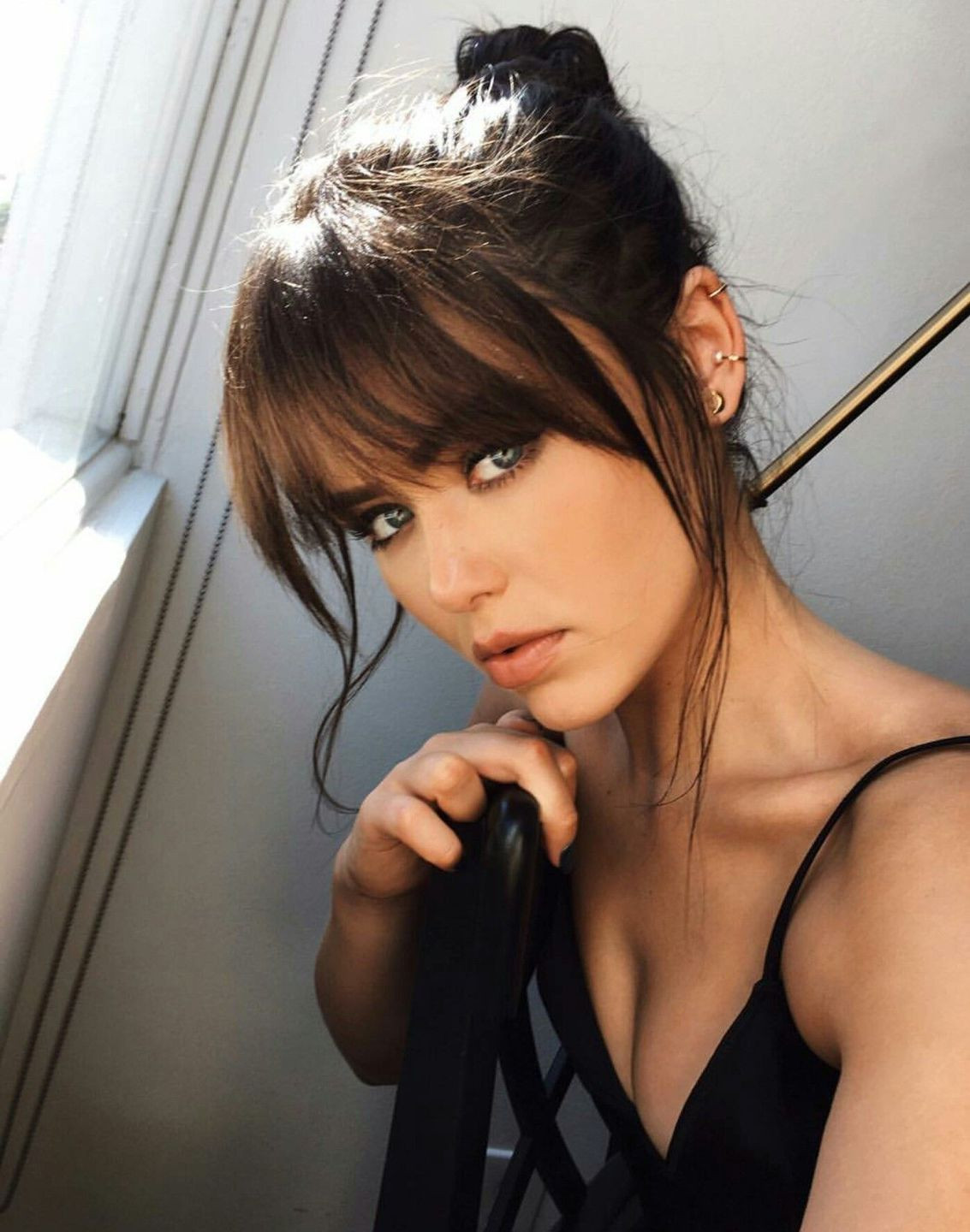 Loose Bun With Wispy Face-Framing Bangs Loose Bun With Wispy Face-Framing Bangs — Bangs 2027 for Square Face
