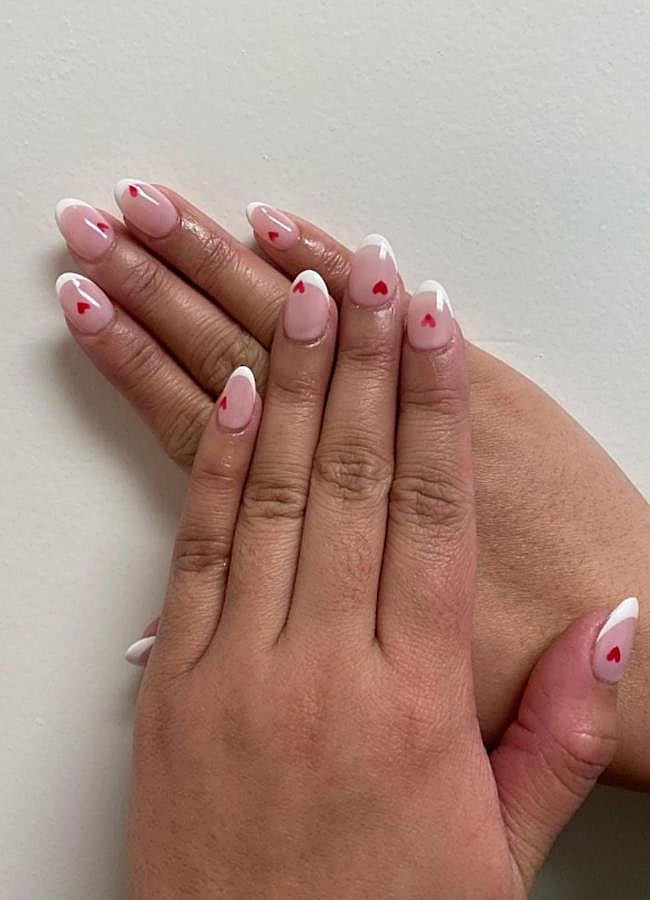 Small Red Hearts On The French Tip Visual Idea Small Red Hearts On The French Tip Visual Idea — Pink Valentines Nails 2027