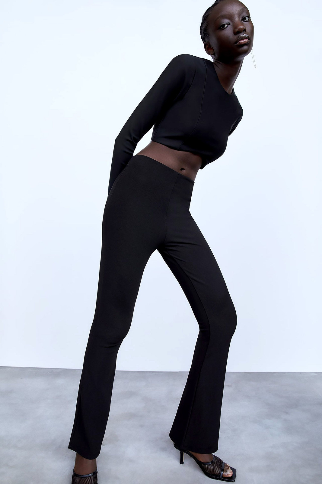 Monochromatic Edge: Black Flare Leggings with a Cropped Top and Heels Monochromatic Edge: Black Flare Leggings with a Cropped Top and Heels — Flare Leggings Outfits 2027