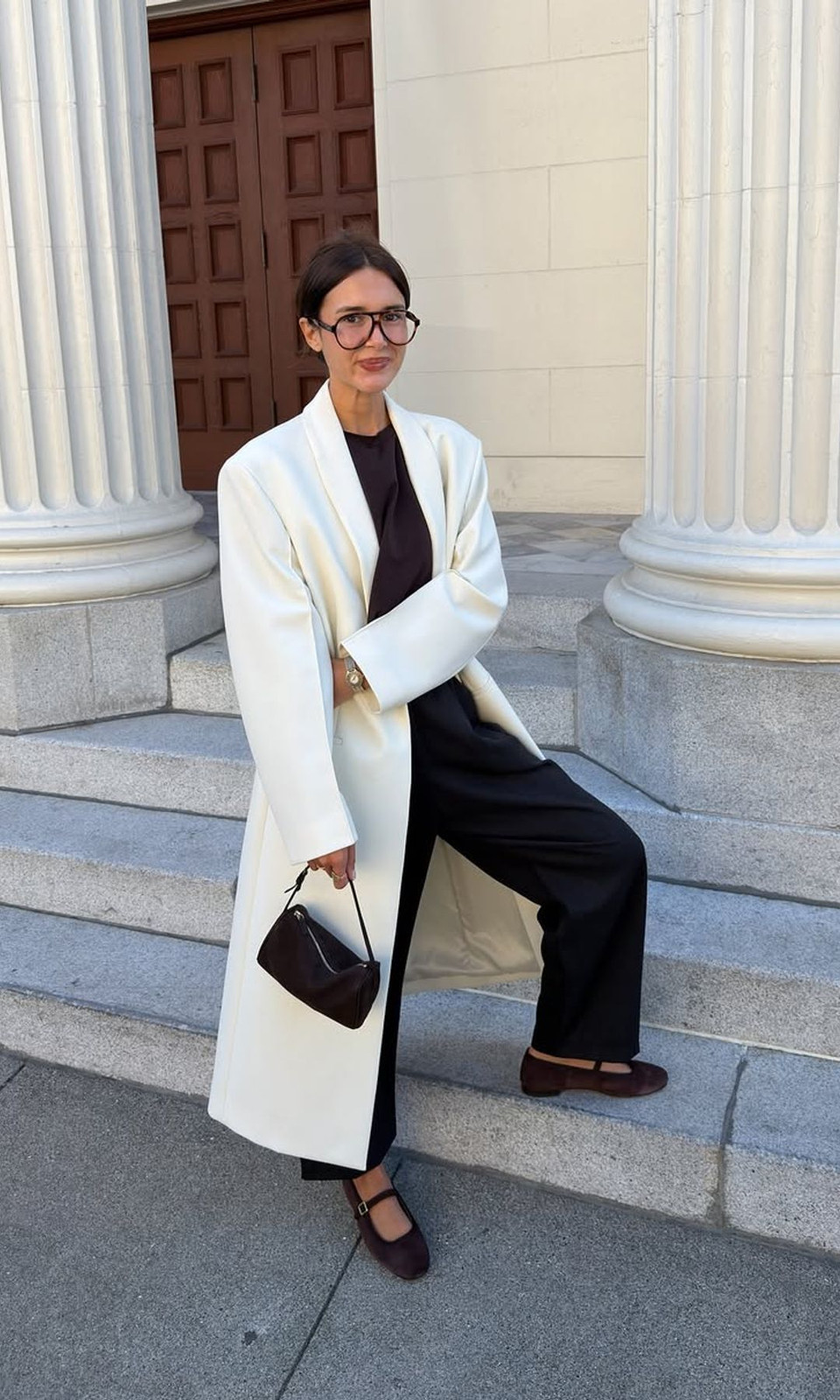 Oversized Ivory Coat Over Black Trousers and Dark Top Oversized Ivory Coat Over Black Trousers and Dark Top — Winter Neutral Outfits 2027