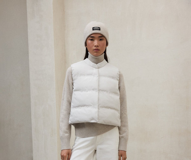 Clean Neutrals: White Vest with Beige Turtleneck and Beanie Clean Neutrals: White Vest with Beige Turtleneck and Beanie — Puffer Vest Outfits 2027