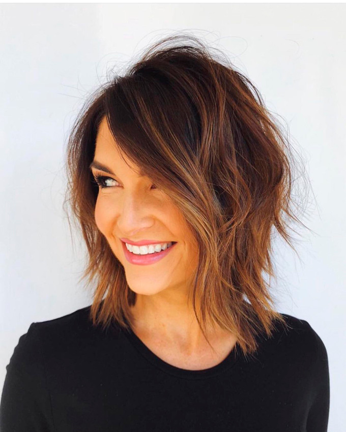 Dark Brown Shaggy Bob With Side Swept Bangs Dark Brown Shaggy Bob With Side Swept Bangs — Layered Bob 2027