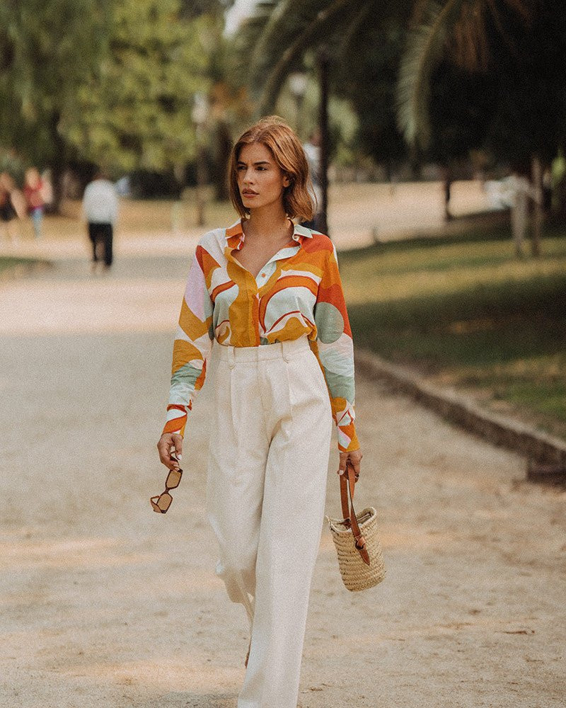Printed Blouse Tucked into Cream Wide-Leg Trousers — French Girl Outfits 2027