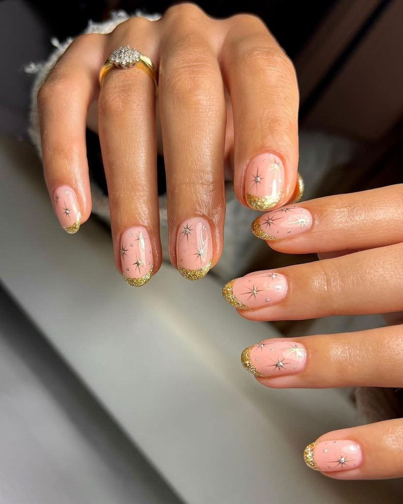 Pale Pink Base Gold Short Round Gold Glitter French Tips Pale Pink Base Gold Short Round Gold Glitter French Tips — Gold Christmas Nails 2026