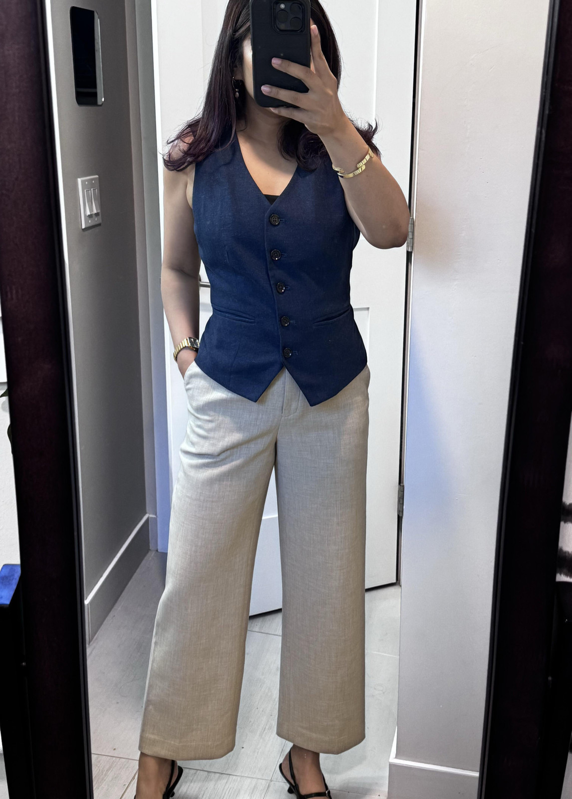 Dark Blue Vest over Black Top with Beige Linen Trousers Dark Blue Vest over Black Top with Beige Linen Trousers — Conference Outfits 2027