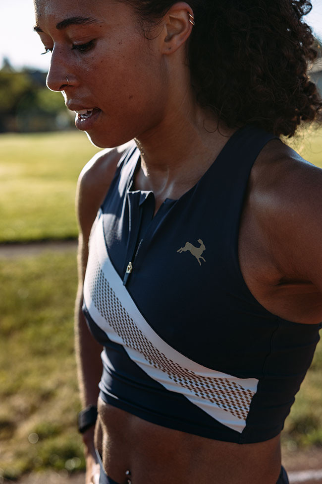 Navy Blue Running Crop Top with Gold Accents and Smartwatch Navy Blue Running Crop Top with Gold Accents and Smartwatch — Running Outfits for Women 2027