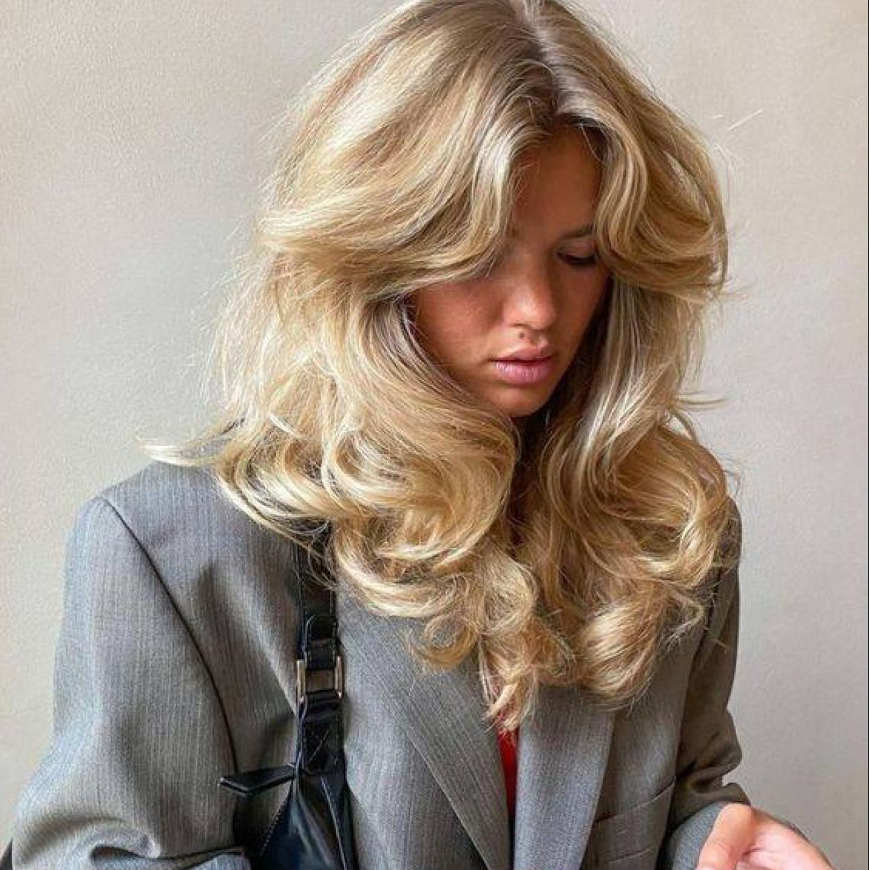 Voluminous Blonde Blowout With Soft Curtain Bangs Voluminous Blonde Blowout With Soft Curtain Bangs — Blowout Hairstyles 2027