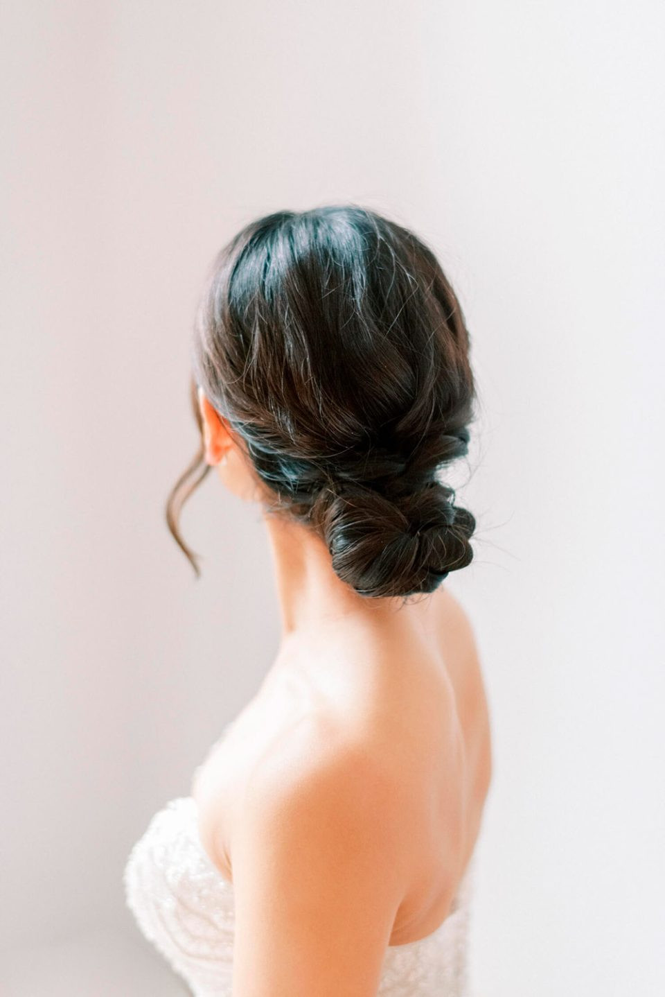 Low Twisted Bun With Wispy Tendrils Visual Idea Low Twisted Bun With Wispy Tendrils Visual Idea — Bridal Updos 2027