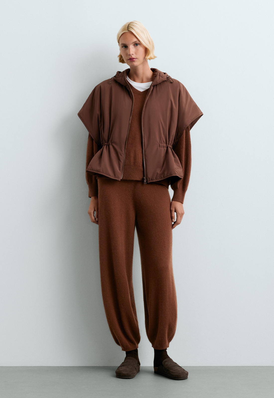 Cozy Neutrals: Brown Knitwear Meets Hooded Puffer Vest Cozy Neutrals: Brown Knitwear Meets Hooded Puffer Vest — Puffer Vest Outfits 2027