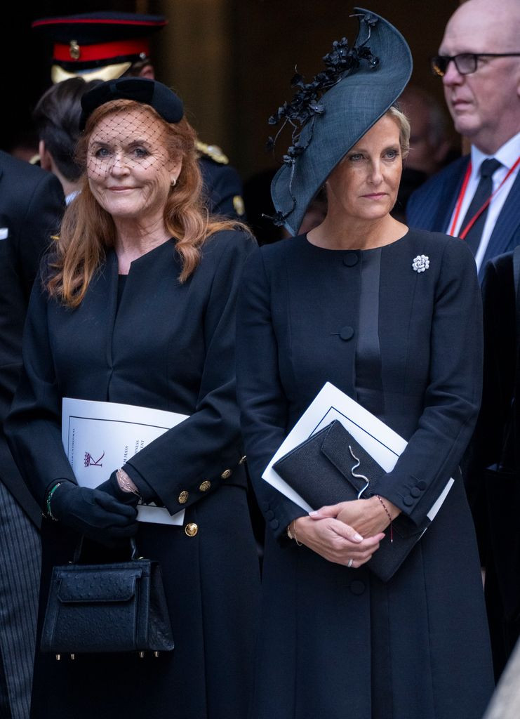 Fitted Black Coat with Gold Buttons and Fascinator — Close-Up Take Fitted Black Coat with Gold Buttons and Fascinator — Close-Up Take — Easter Church Outfits 2027