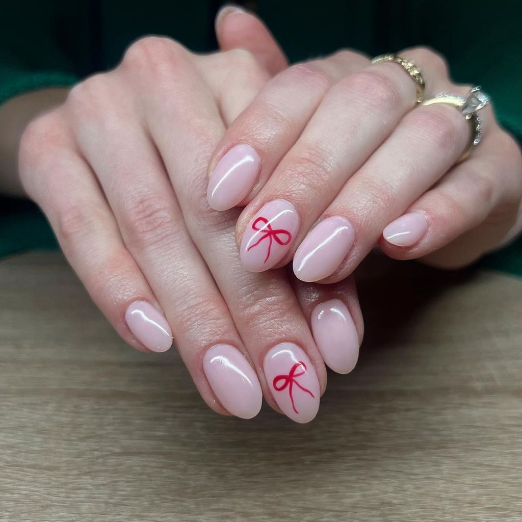 Simple Red Bows on Pale Pink Simple Red Bows on Pale Pink — Christmas Bow Nails 2026