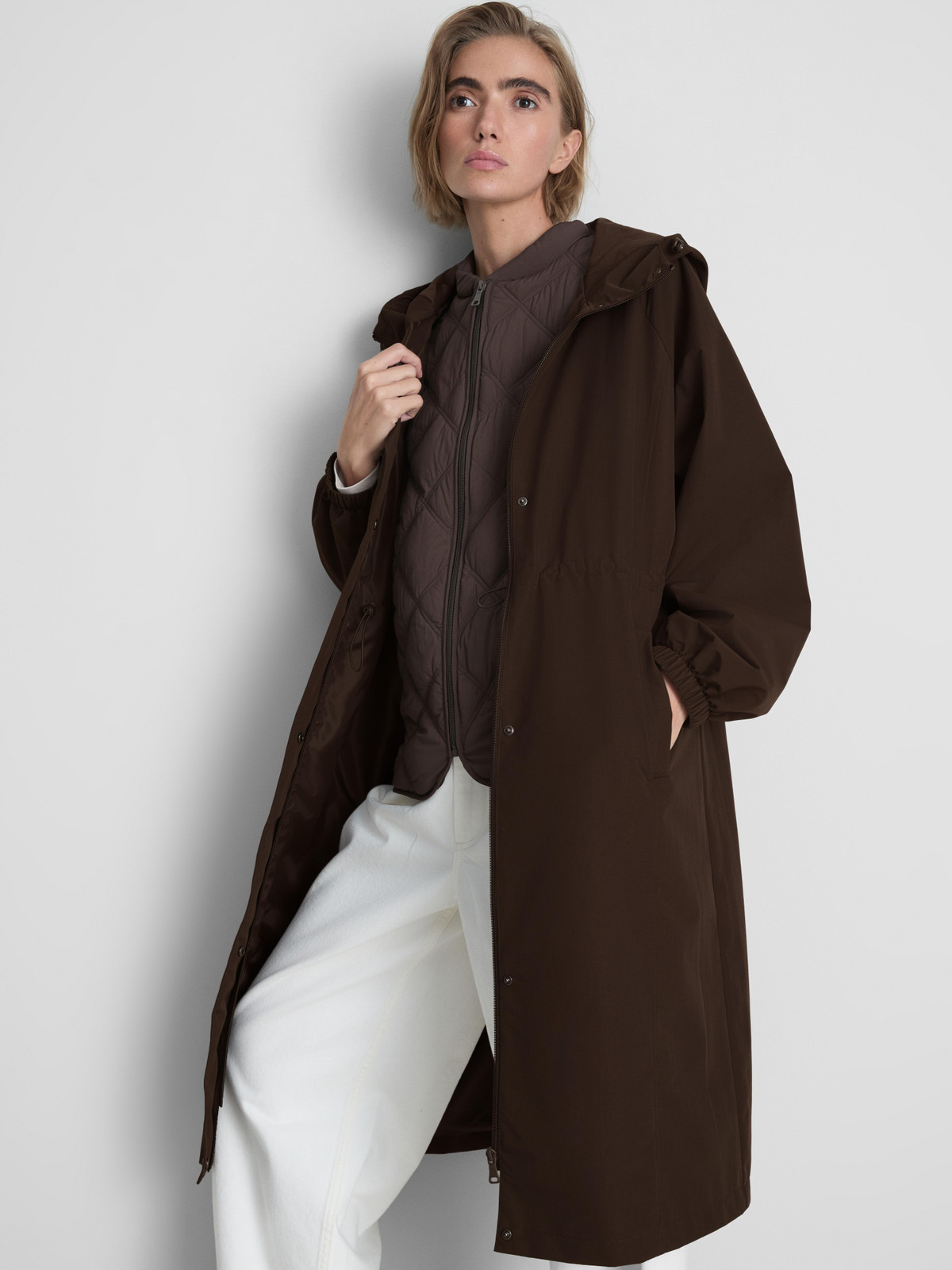 Dark Brown Hooded Parka and Quilted Vest for Practical Winter Warmth — Winter Everyday Outfits 2027