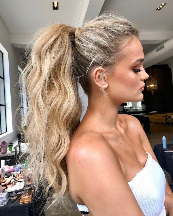High Ponytail with Voluminous Waves High Ponytail with Voluminous Waves — Christmas Party Hairstyles 2026