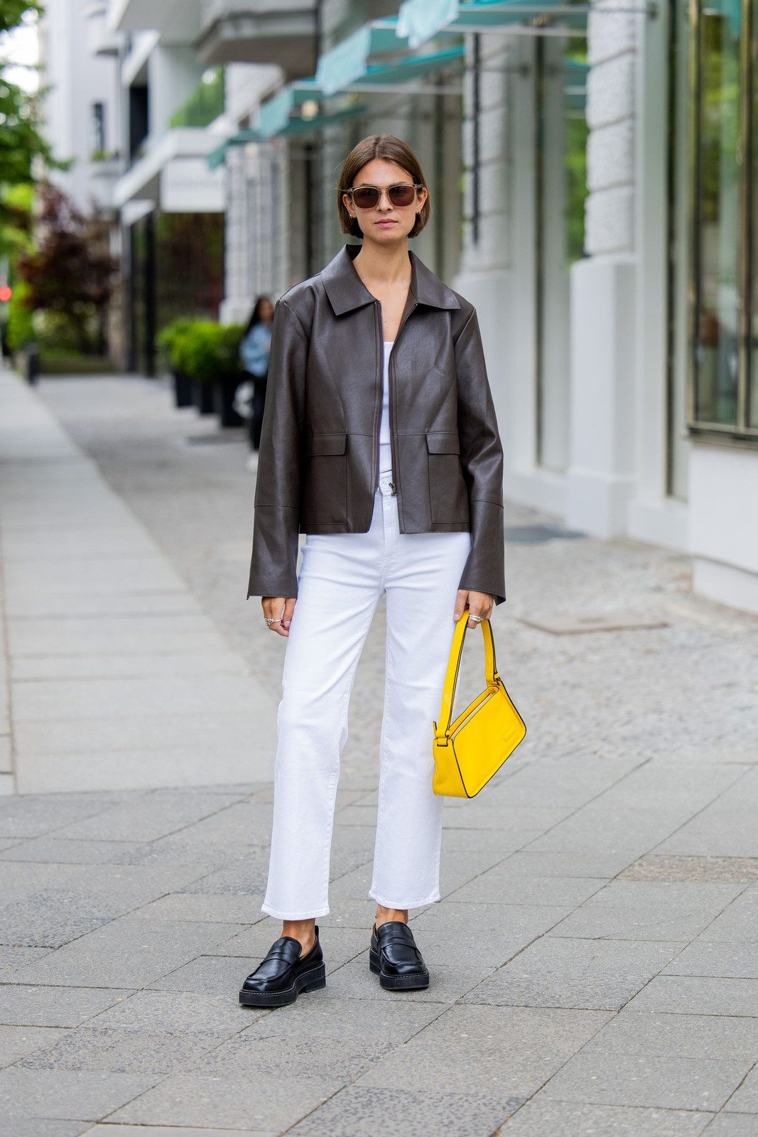 Casual White Trousers with a Leather Jacket and Bright Accessories Casual White Trousers with a Leather Jacket and Bright Accessories — Trouser Outfits 2027