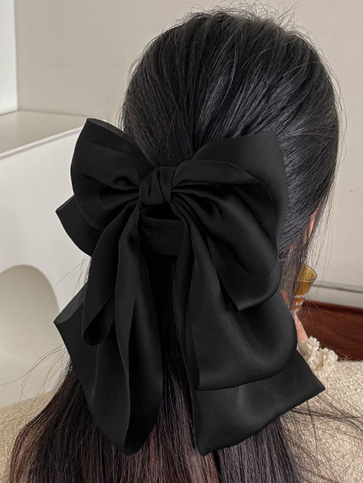 Sleek Low Ponytail with Oversized Bow — Ribbon Hairstyles 2027