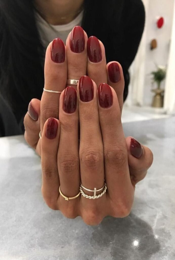 None Glossy Deep Red Medium Oval Nails — Nails 2027 for Brown Skin