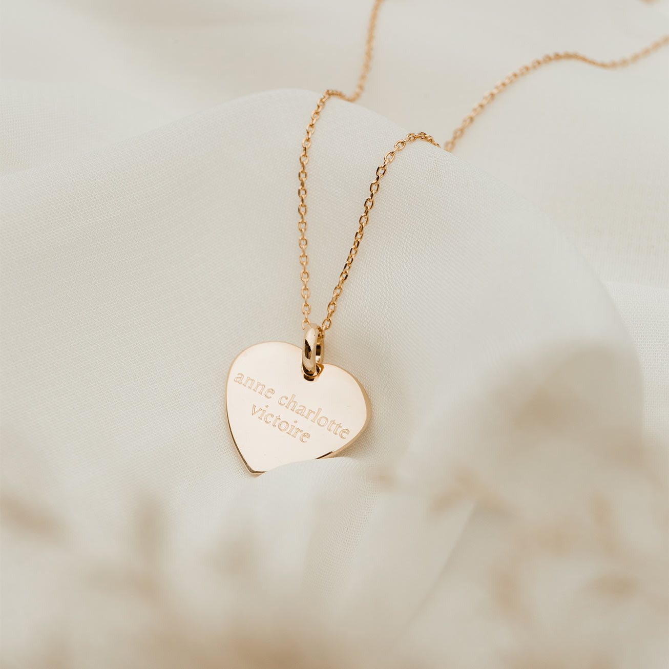 Personalized Engraved Gold Heart Locket on Draped Off-White Fabric Personalized Engraved Gold Heart Locket on Draped Off-White Fabric — Locket Necklaces 2027