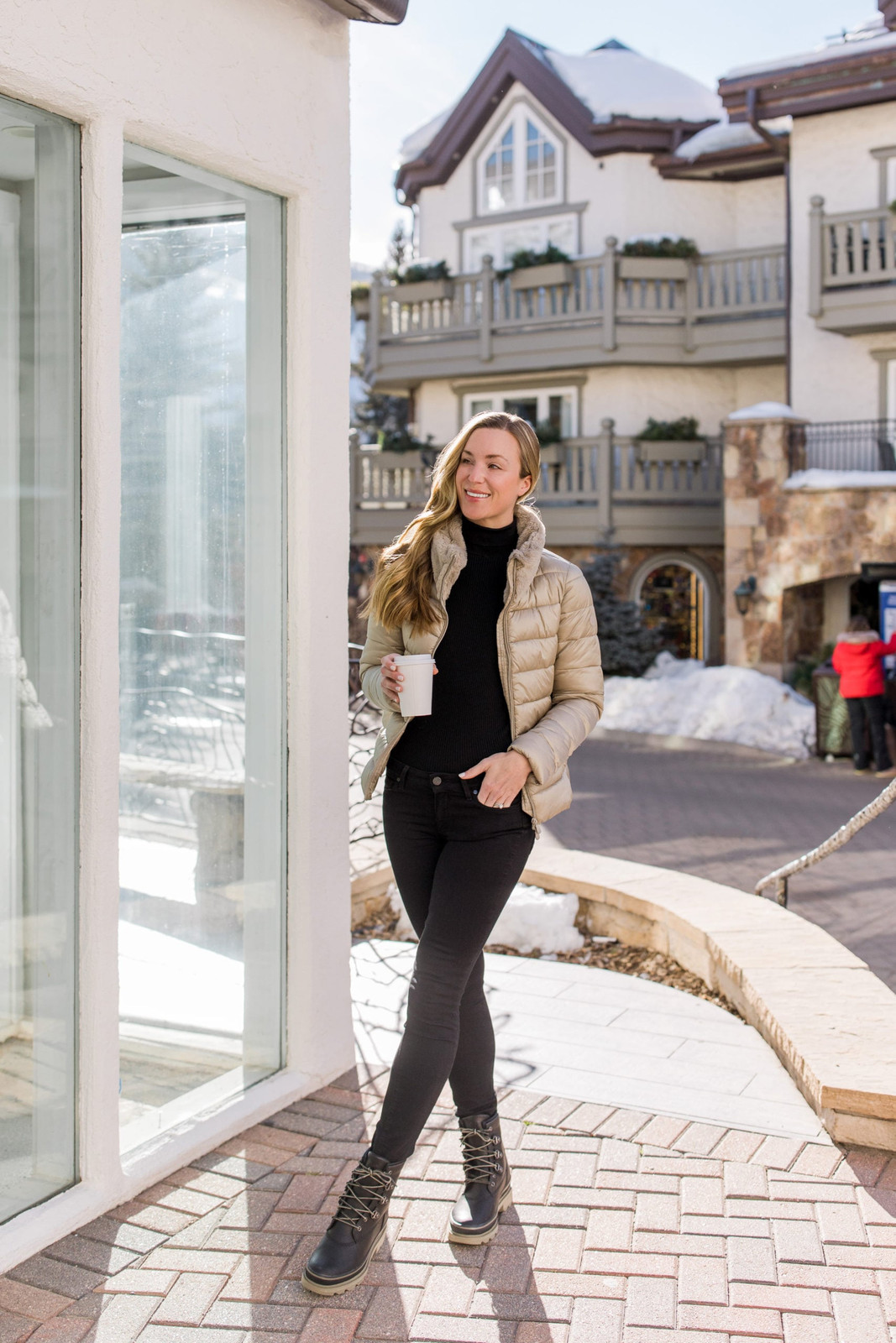 Beige Puffer Jacket with Black Fitted Pants Beige Puffer Jacket with Black Fitted Pants — Apres Ski Outfits 2027