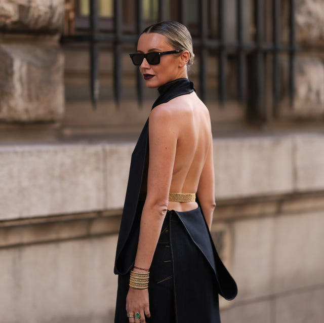 Black Halter Top with Open Back Paired with Denim Skirt and Chain Belt Black Halter Top with Open Back Paired with Denim Skirt and Chain Belt — Backless Dresses 2027