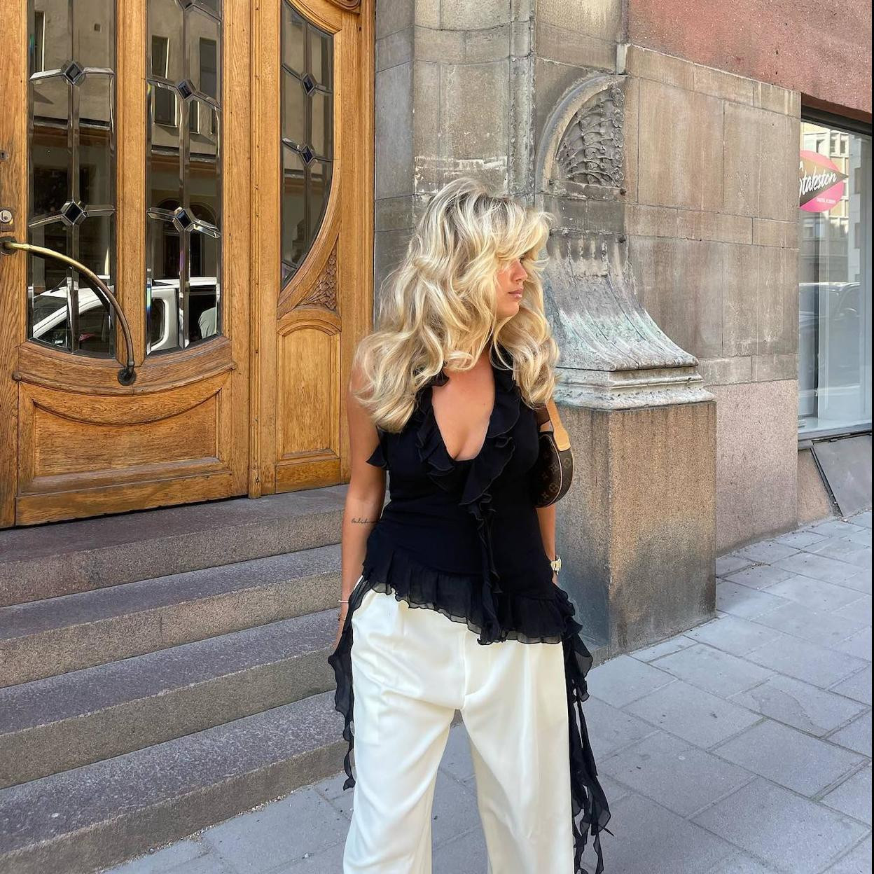 Black Halter Top with Ruffled Trim and Wide-Leg Trousers for Casual Polish Black Halter Top with Ruffled Trim and Wide-Leg Trousers for Casual Polish — Ruffle Top Outfits 2027