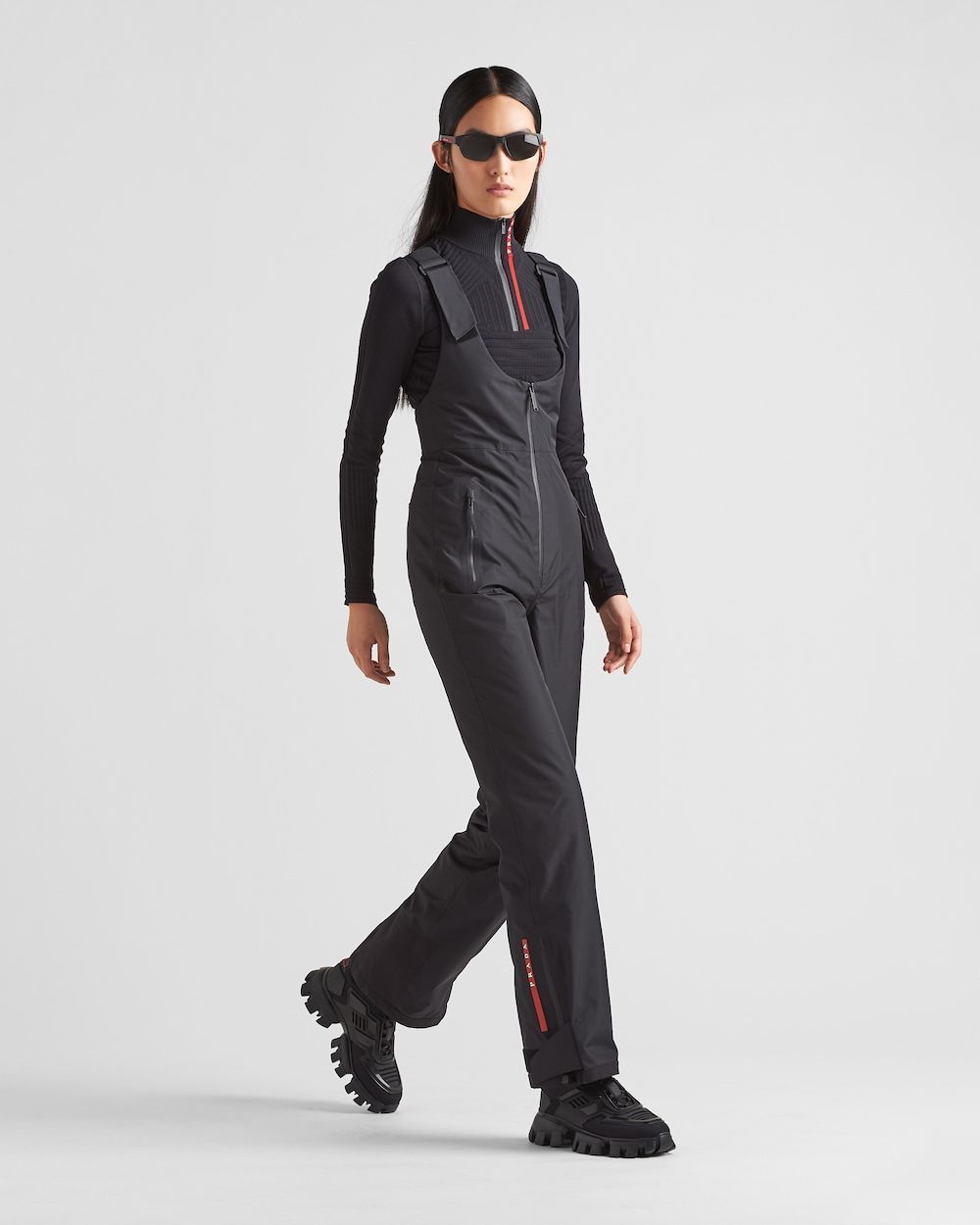Black Ski Overalls with Red Accents for Chic Après-Ski Black Ski Overalls with Red Accents for Chic Après-Ski — Ski Outfits for Women 2027