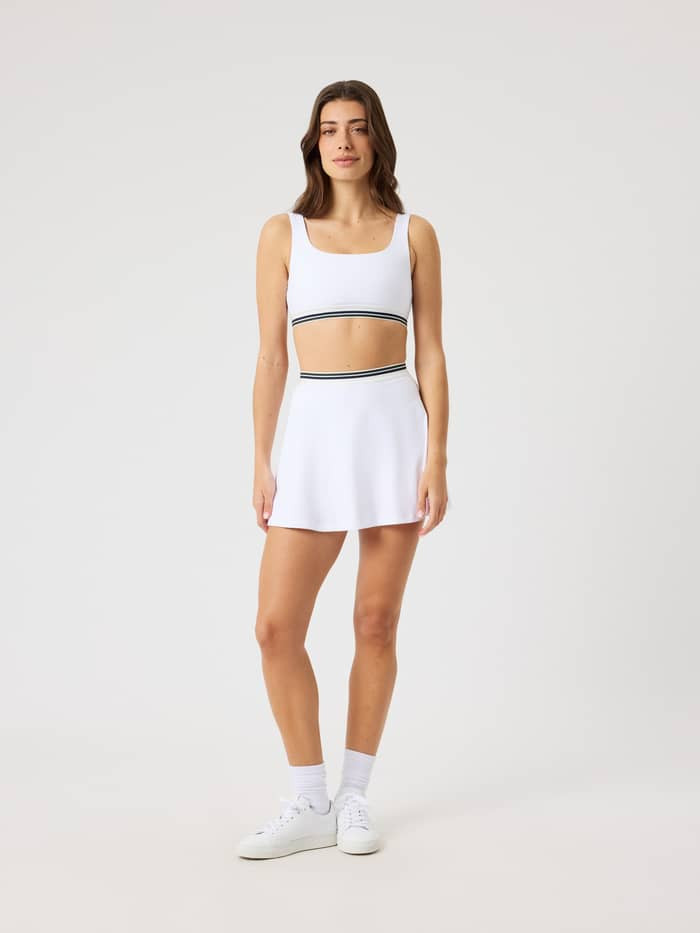 White Sneakers Textured White Tennis Skirt and Sports Bra Combo White Sneakers Textured White Tennis Skirt and Sports Bra Combo — Tennis Skirt Outfits 2027