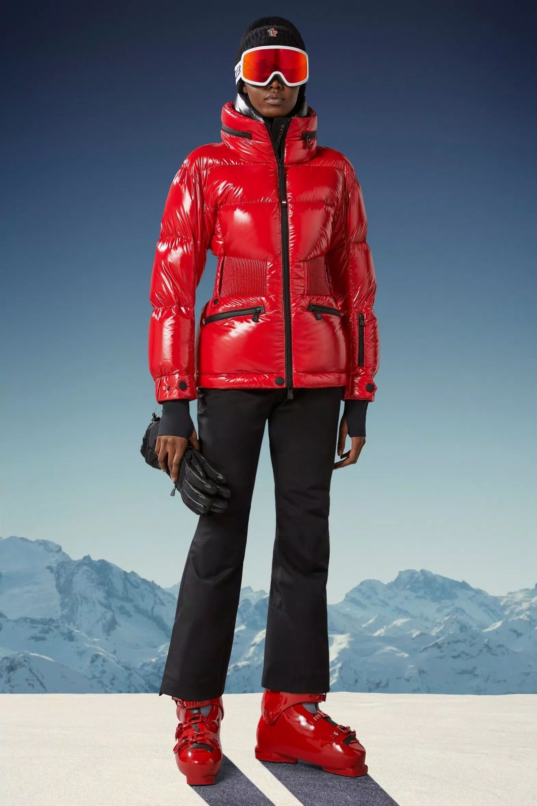 Skiing Striking Red Shiny Puffer Jacket with Black Ski Pants Skiing Striking Red Shiny Puffer Jacket with Black Ski Pants — Ski Outfits for Women 2027
