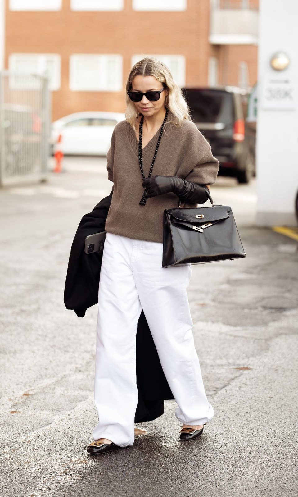 Layered Casual: White Wide-Leg Jeans with Brown Sweater and Black Coat Layered Casual: White Wide-Leg Jeans with Brown Sweater and Black Coat — White Jeans Outfits 2027