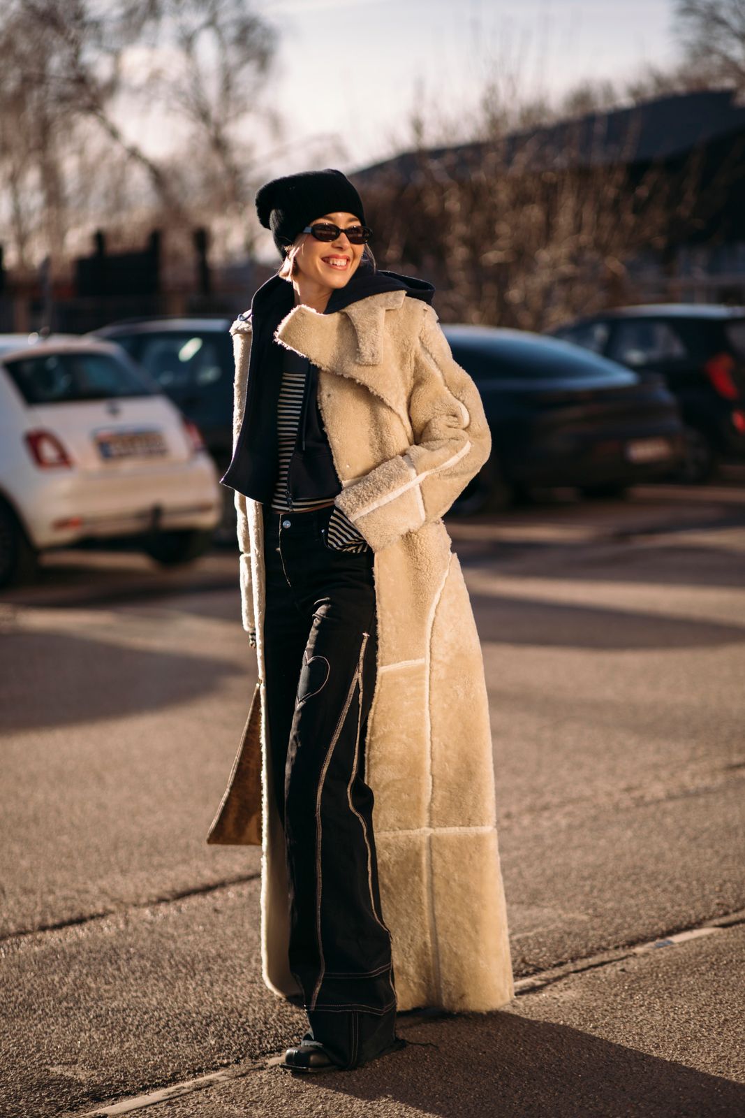 Fashionable Cream Teddy Coat with Black Trousers and White Boots — Teddy Coat Outfits 2027
