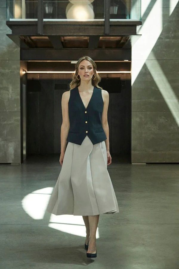 Navy Vest with Gold Buttons Over White Blouse Navy Vest with Gold Buttons Over White Blouse — Vest Outfits 2027