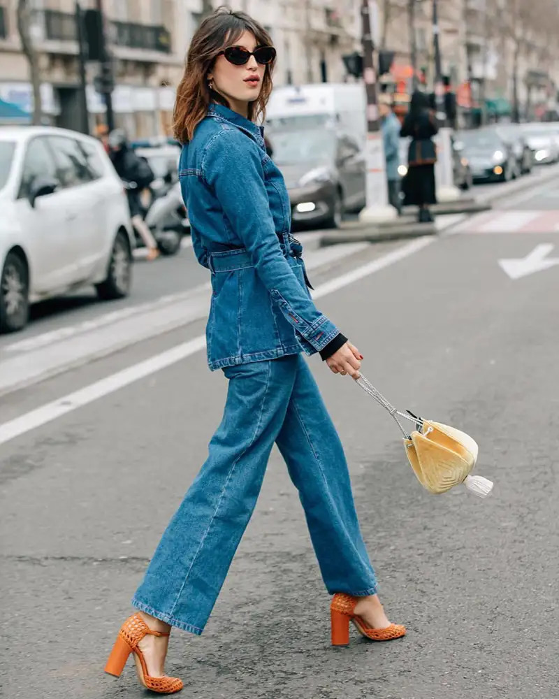 Denim Jumpsuit with Orange Woven Heels and Yellow Clutch — French Girl Outfits 2027