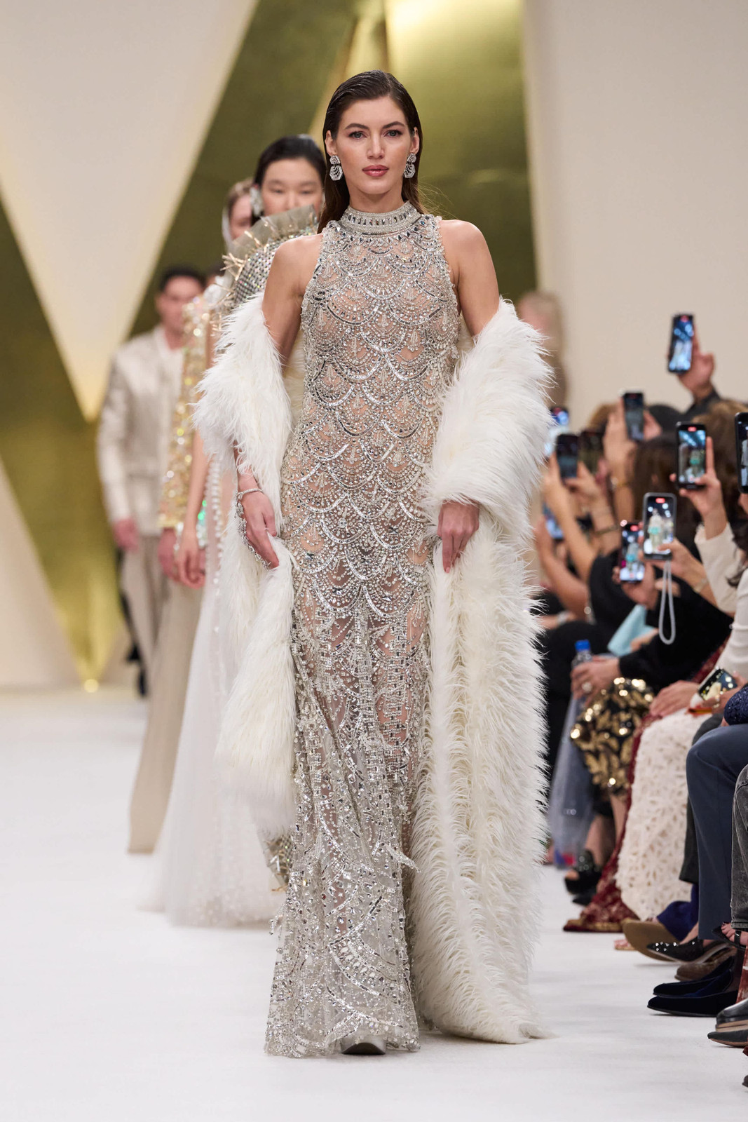 High-Fashion Silver Gown with Faux Fur Stole High-Fashion Silver Gown with Faux Fur Stole — Dubai Outfits 2027