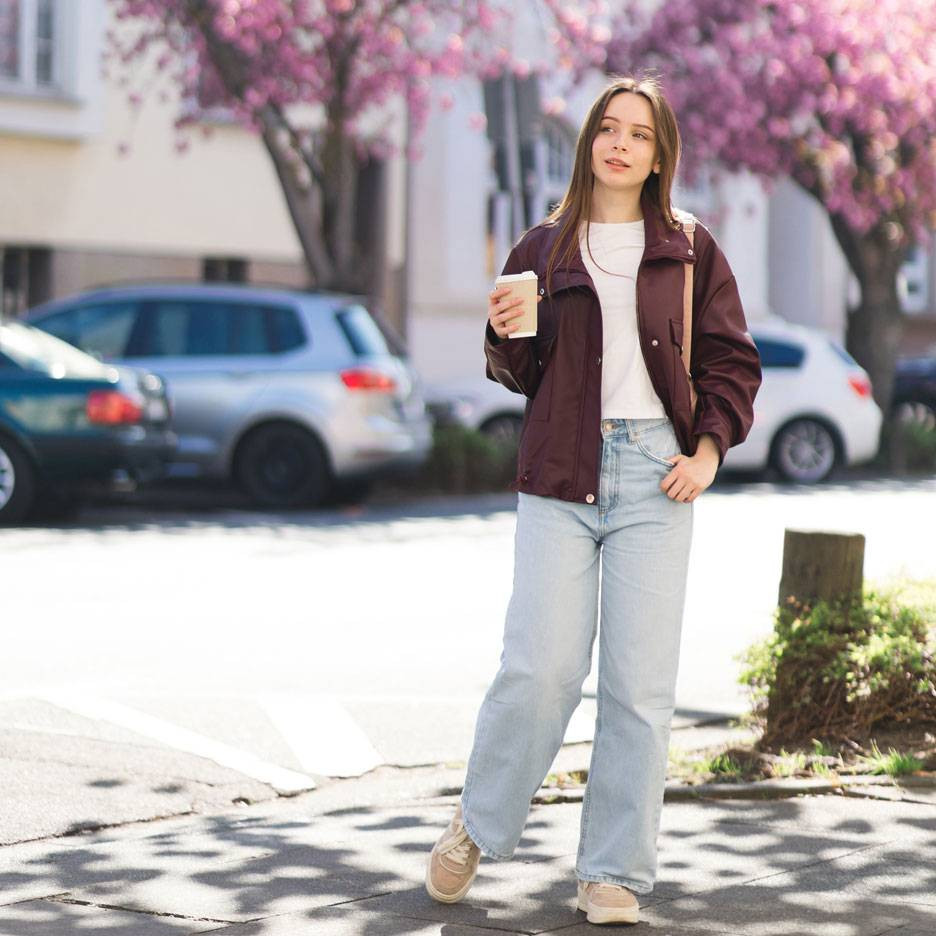 Burgundy Bomber Jacket Over a White Tee and Light Blue Jeans Burgundy Bomber Jacket Over a White Tee and Light Blue Jeans — Spring Europe Outfits 2027