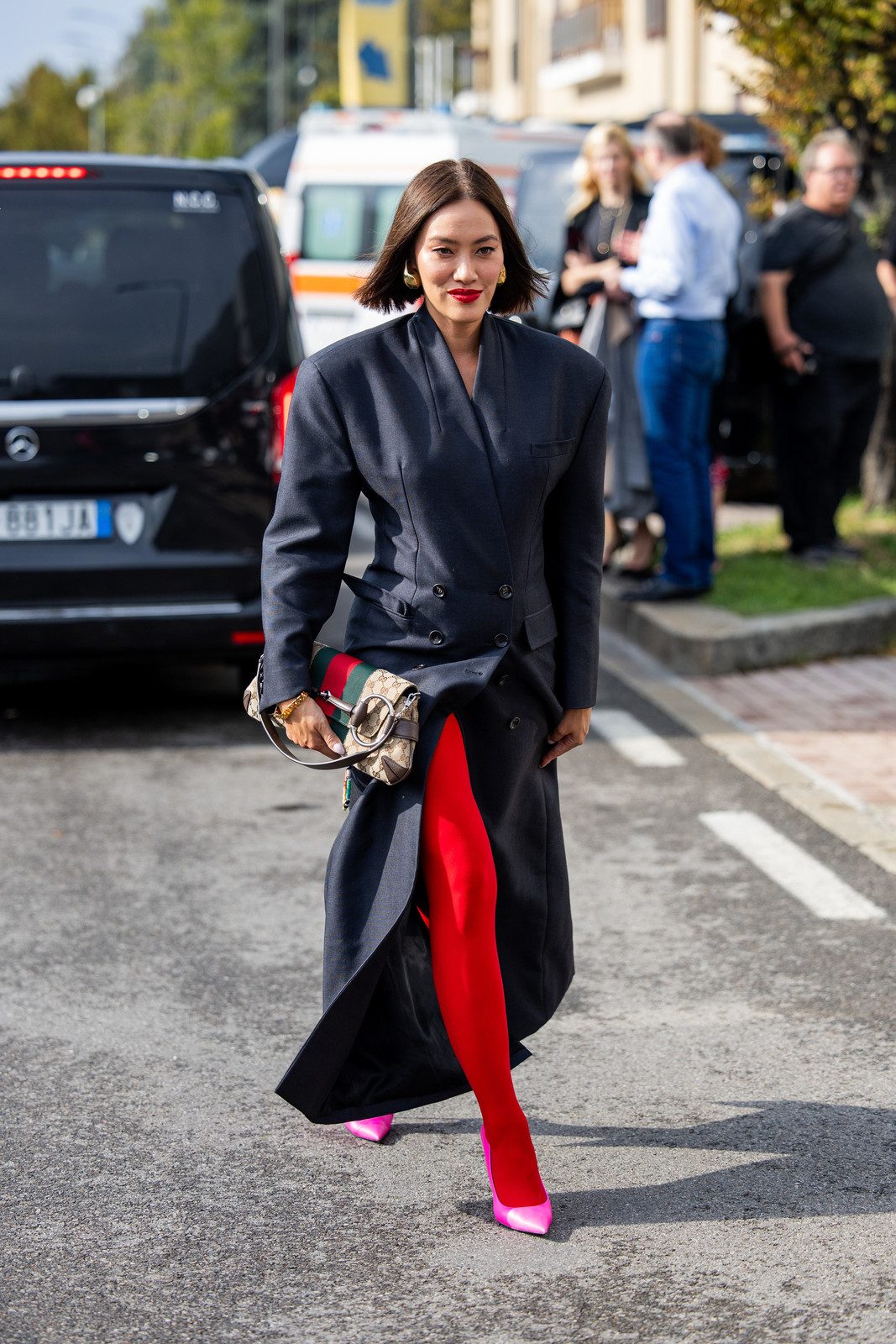 Bold Red Sheer Tights Against a Dark Grey Coat — Sheer Tights Outfits 2027
