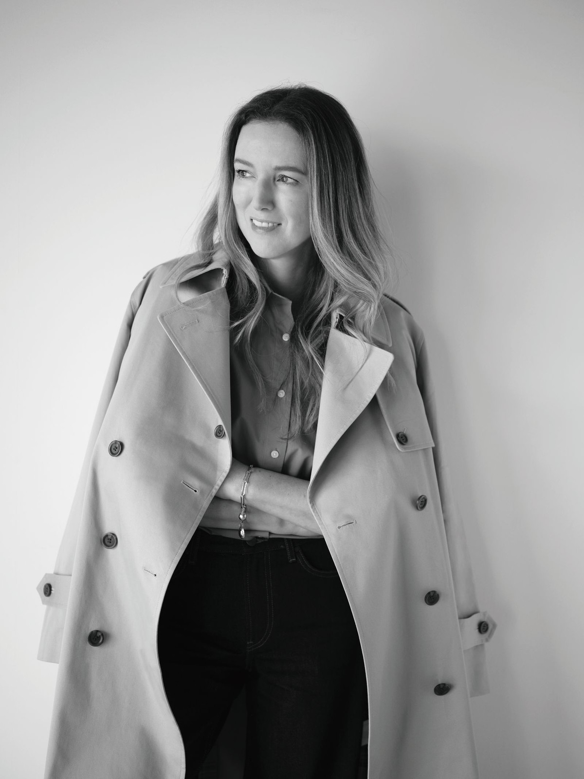 Beige Trench Coat Draped Over Blue Shirt and Jeans Beige Trench Coat Draped Over Blue Shirt and Jeans — Winter Interview Outfits 2027
