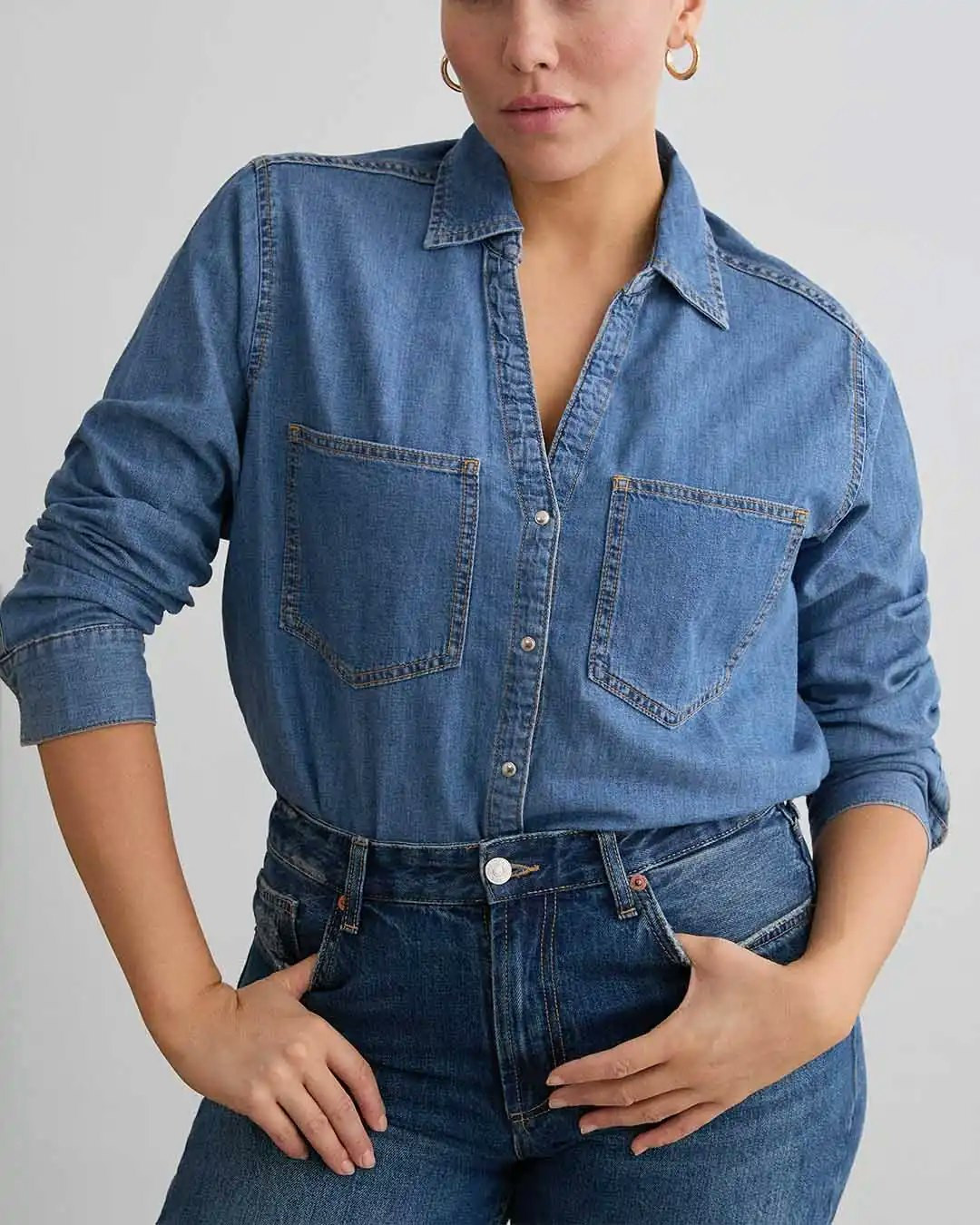 Relaxed Denim Shirt Over Black Tank Top Relaxed Denim Shirt Over Black Tank Top — Denim Shirt Outfits 2027