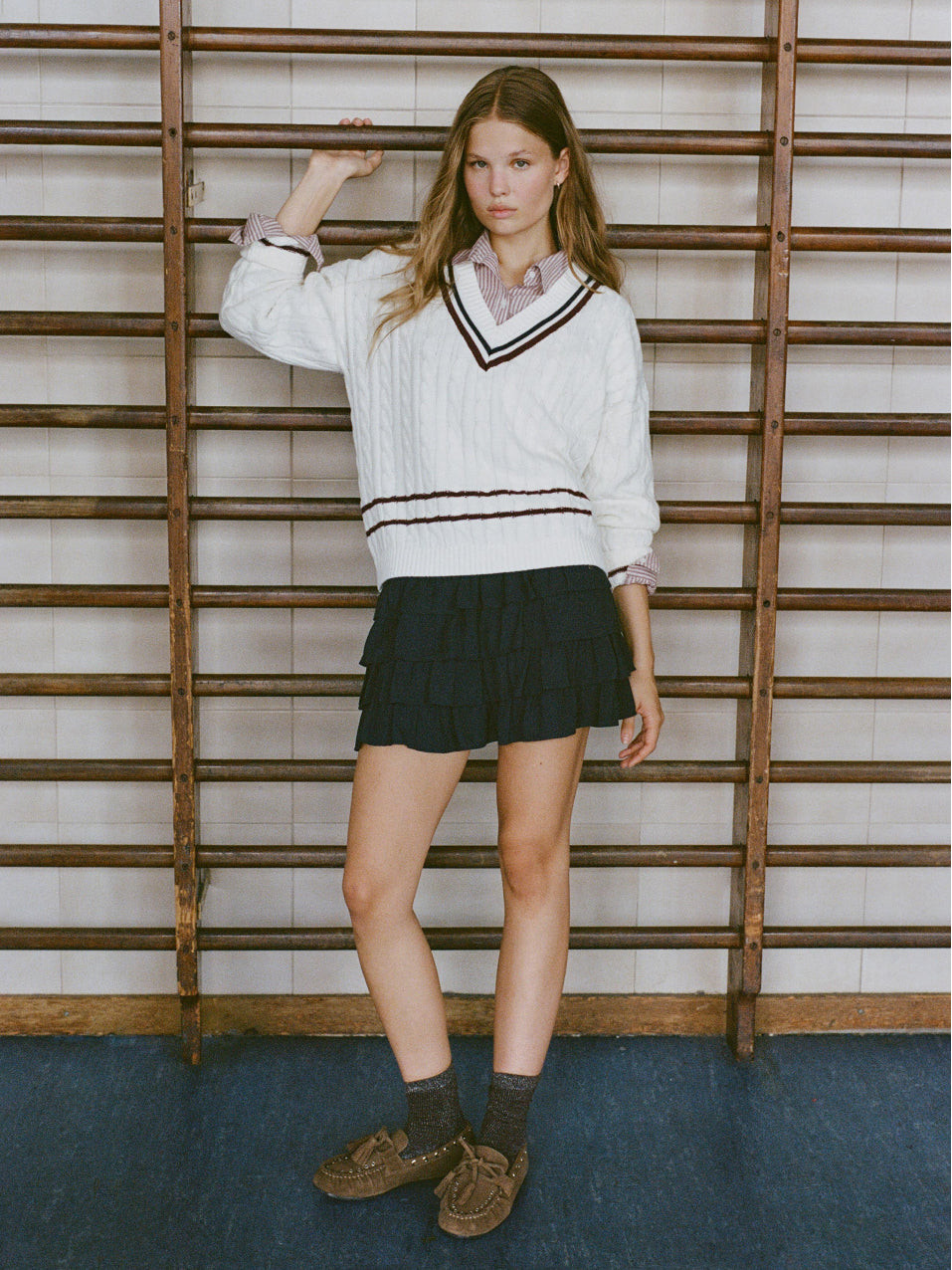 Preppy Layering: Cable Knit Sweater Over Striped Shirt with Mini Skirt Preppy Layering: Cable Knit Sweater Over Striped Shirt with Mini Skirt — Teen Outfits 2027