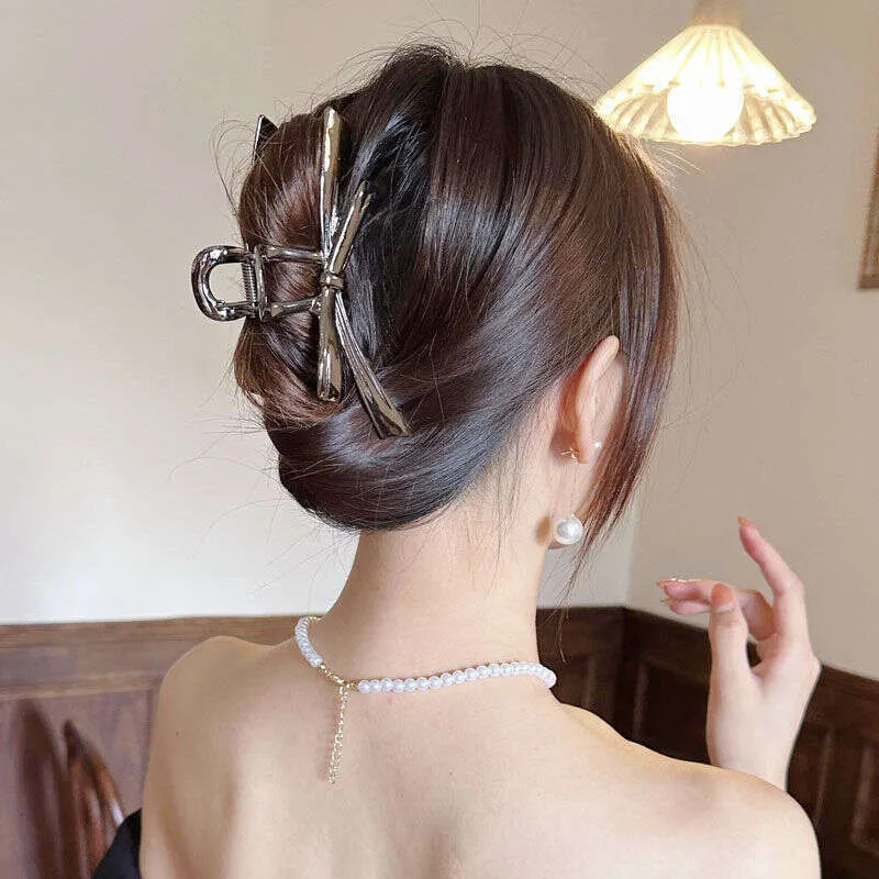 Back View Medium Crop Visual Idea — Claw Clip Bun 2027