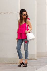 Vibrant Pink Ruffle Top with Embroidered Jeans for a Casual Statement Vibrant Pink Ruffle Top with Embroidered Jeans for a Casual Statement — Ruffle Top Outfits 2027
