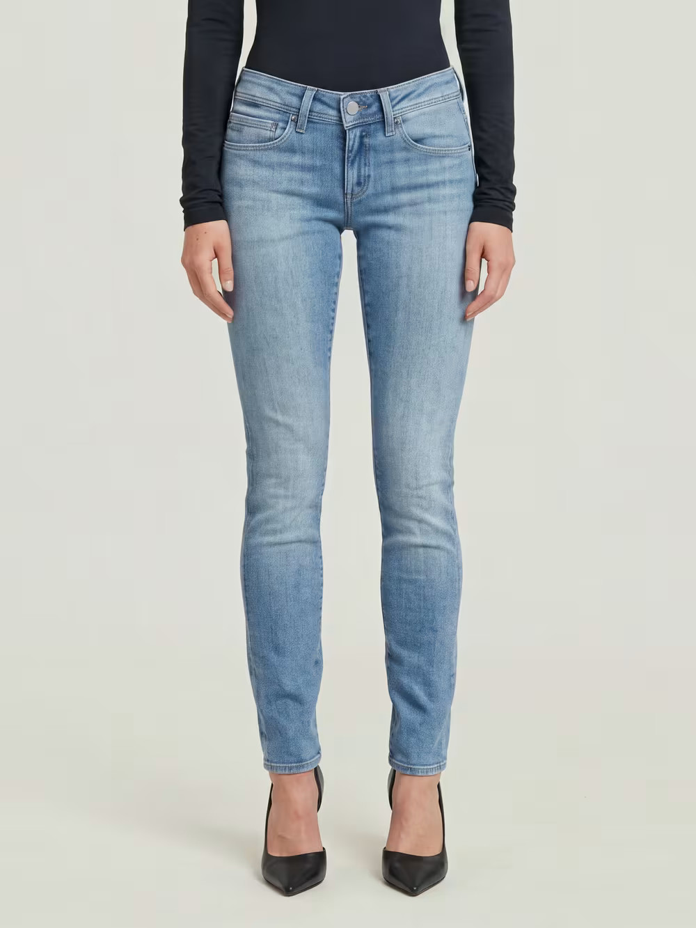 Monochromatic Light Blue Skinny Jeans and Top with Black Heels — Scene Skinny Jeans Outfits 2027