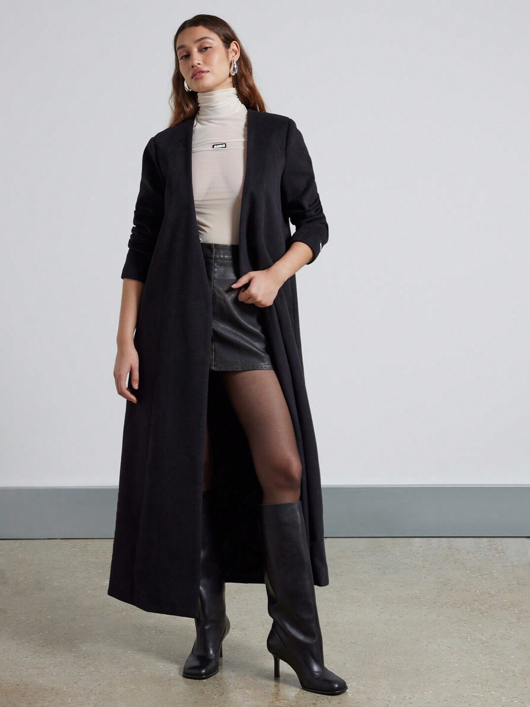 Black Knee-High Boots Outfit Idea Black Knee-High Boots Outfit Idea — Winter Interview Outfits 2027