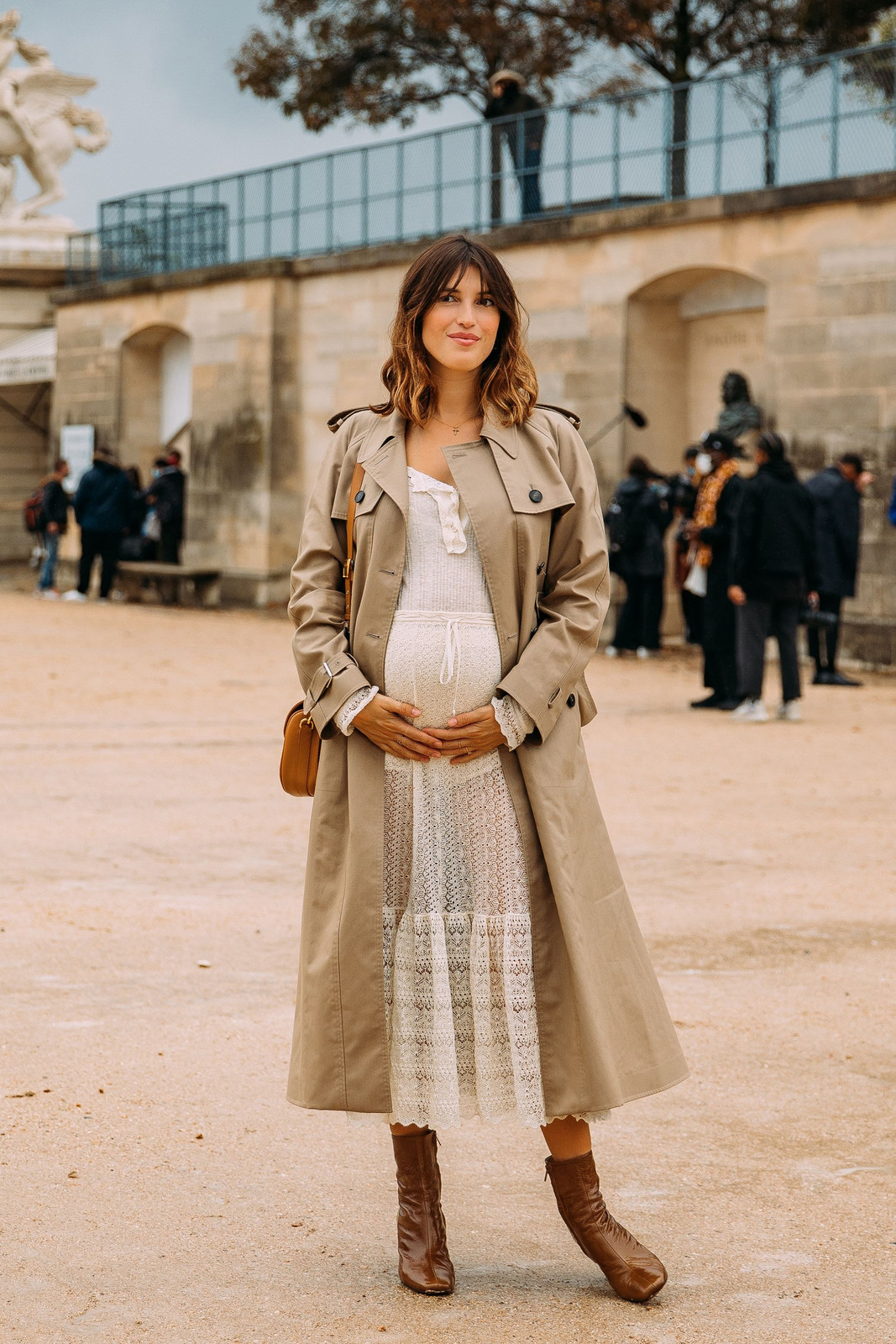 Chic Maternity Ensemble: Lace Dress Paired with Beige Trench Chic Maternity Ensemble: Lace Dress Paired with Beige Trench — Maternity Outfits 2027