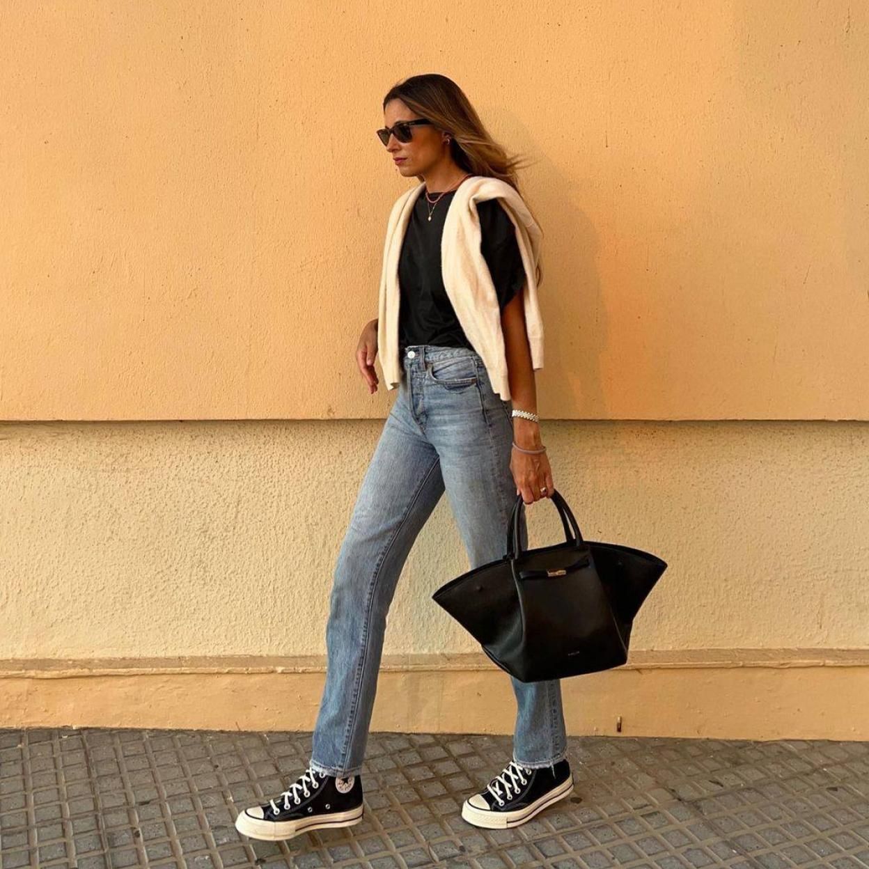 Cream Cardigan Draped Over Black Tee and Jeans Cream Cardigan Draped Over Black Tee and Jeans — Everyday Outfits 2027