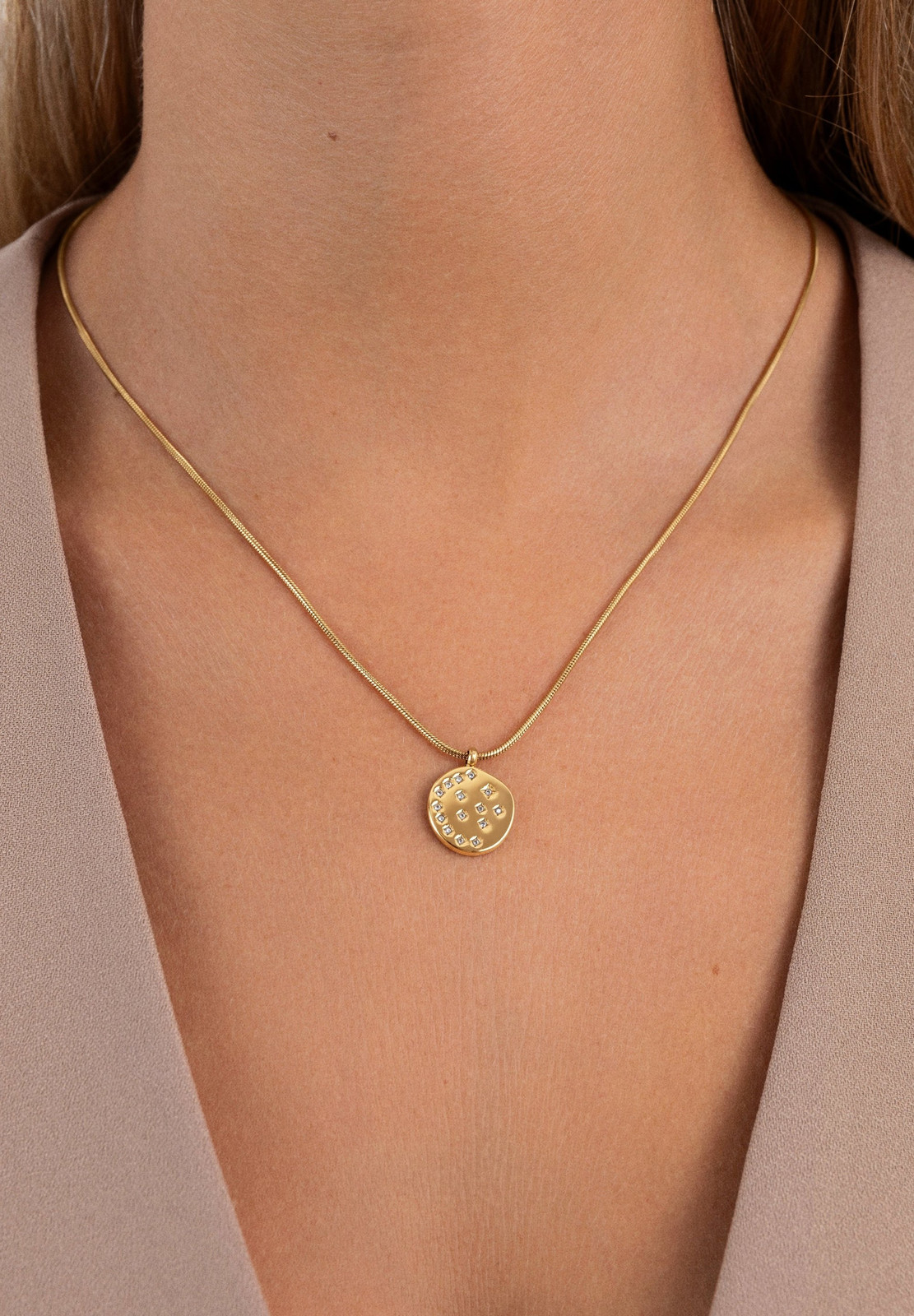 Beige Blazer Styled with a Stone-Adorned Gold Disc Pendant Beige Blazer Styled with a Stone-Adorned Gold Disc Pendant — Locket Necklaces 2027