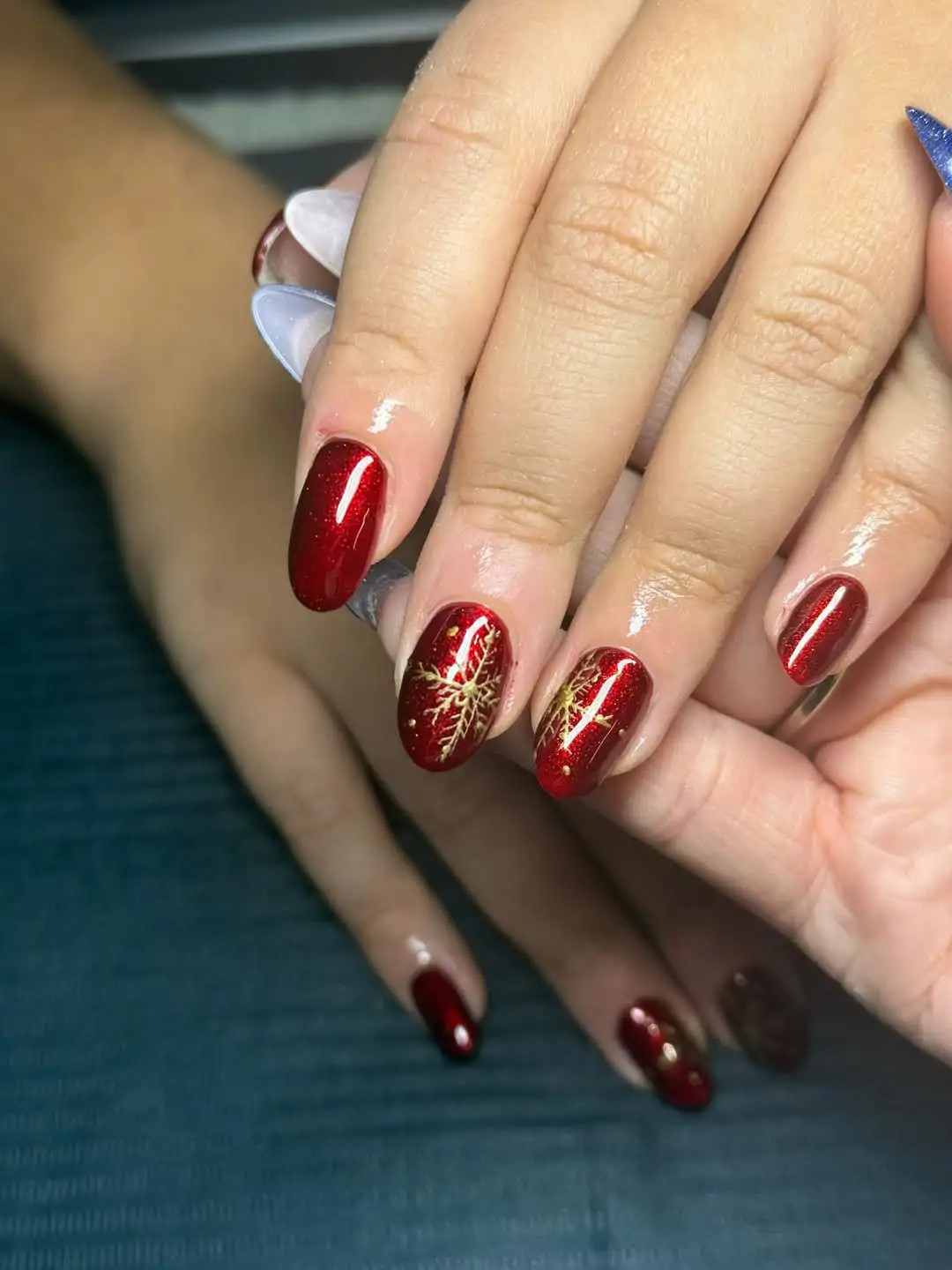 Deep Red with Gold Snowflake Accents Deep Red with Gold Snowflake Accents — Gold Christmas Nails 2026
