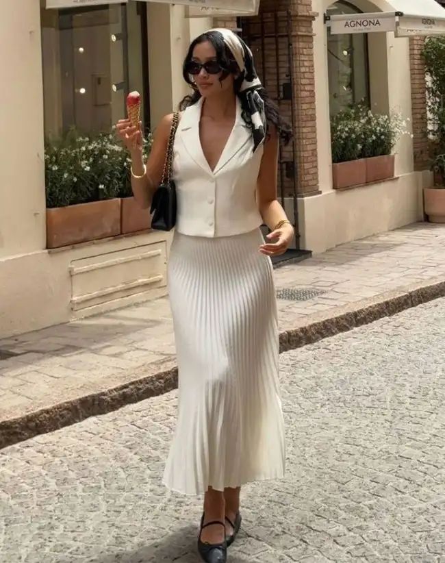 White Sleeveless Vest with Pleated Midi Skirt White Sleeveless Vest with Pleated Midi Skirt — Vest Outfits 2027